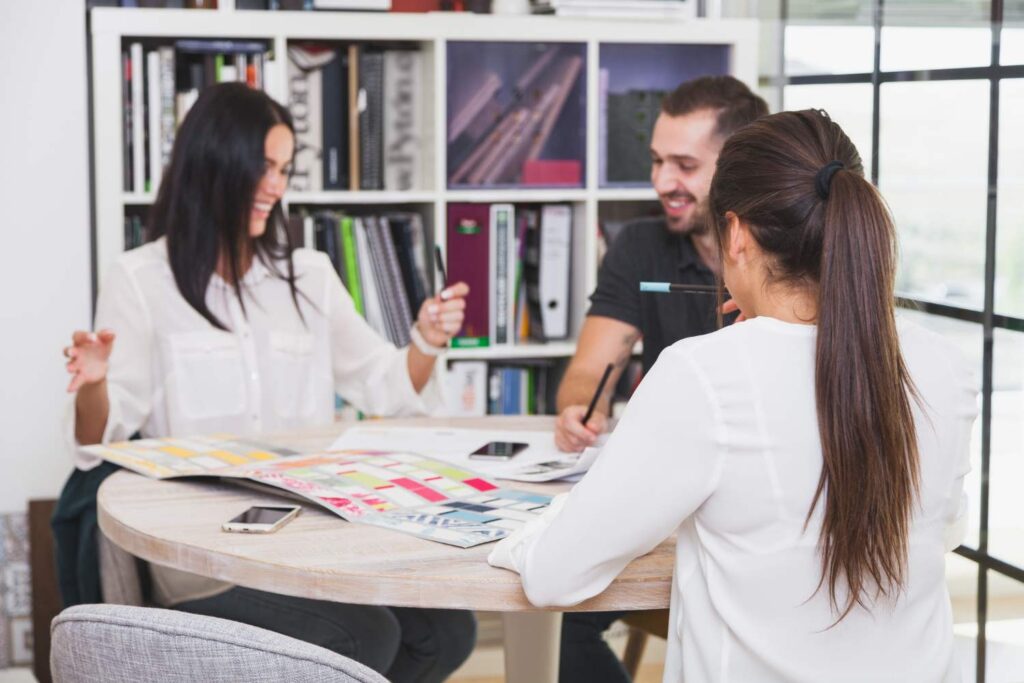 Cheerful coworking designers in office